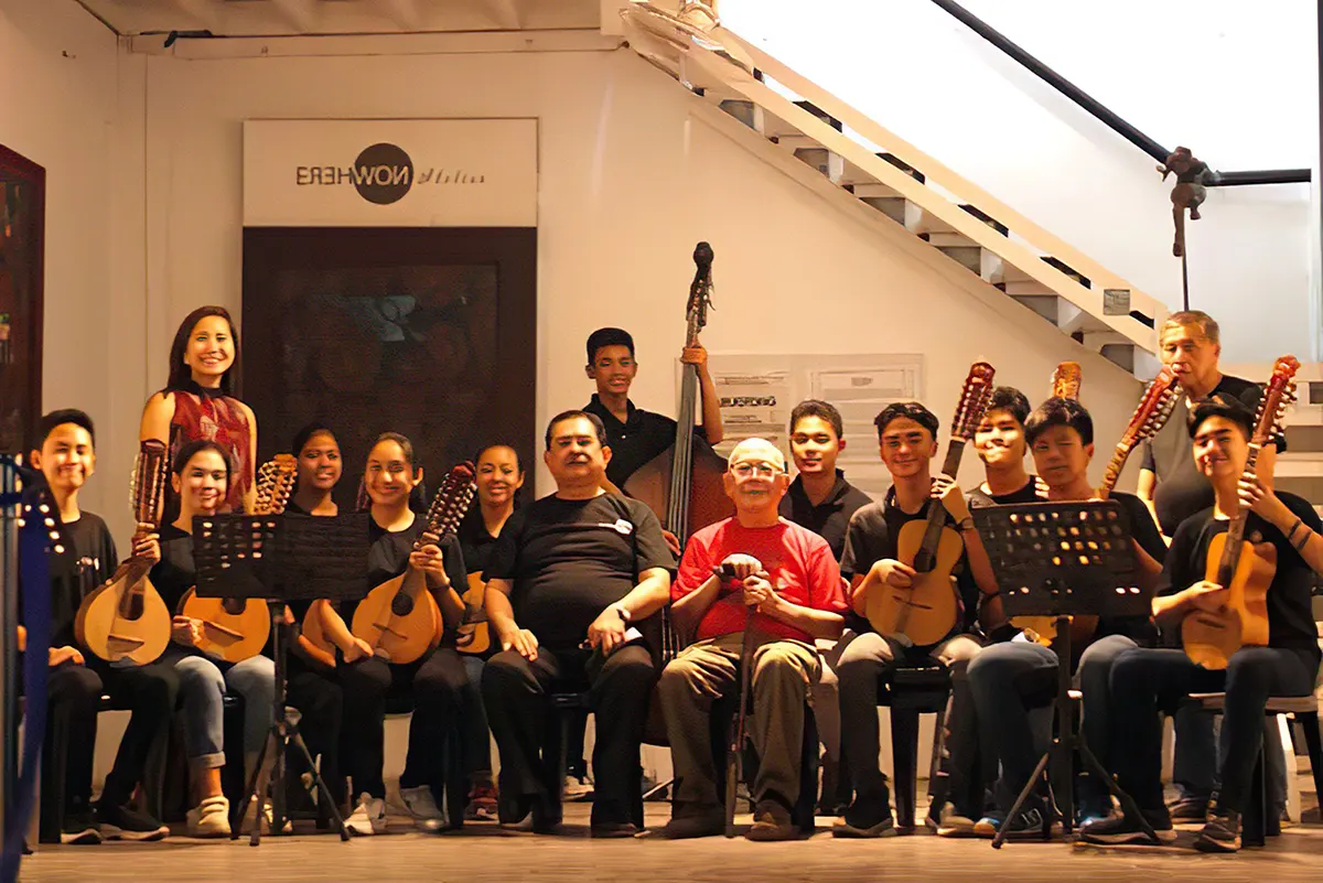 National artist Bienvenido Lumbera (center) poses with young musicians of the Erehwon Youth Rondalla. On his right is Erehwon Artworld CEO Rafael Benitez.